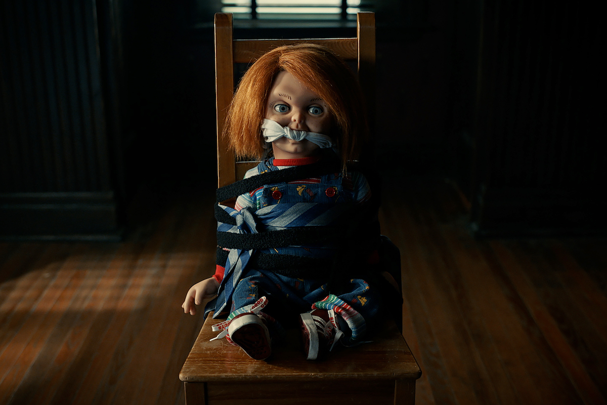 'Chucky' Season 2: Chucky sits tied to a chair with a gag in his mouth