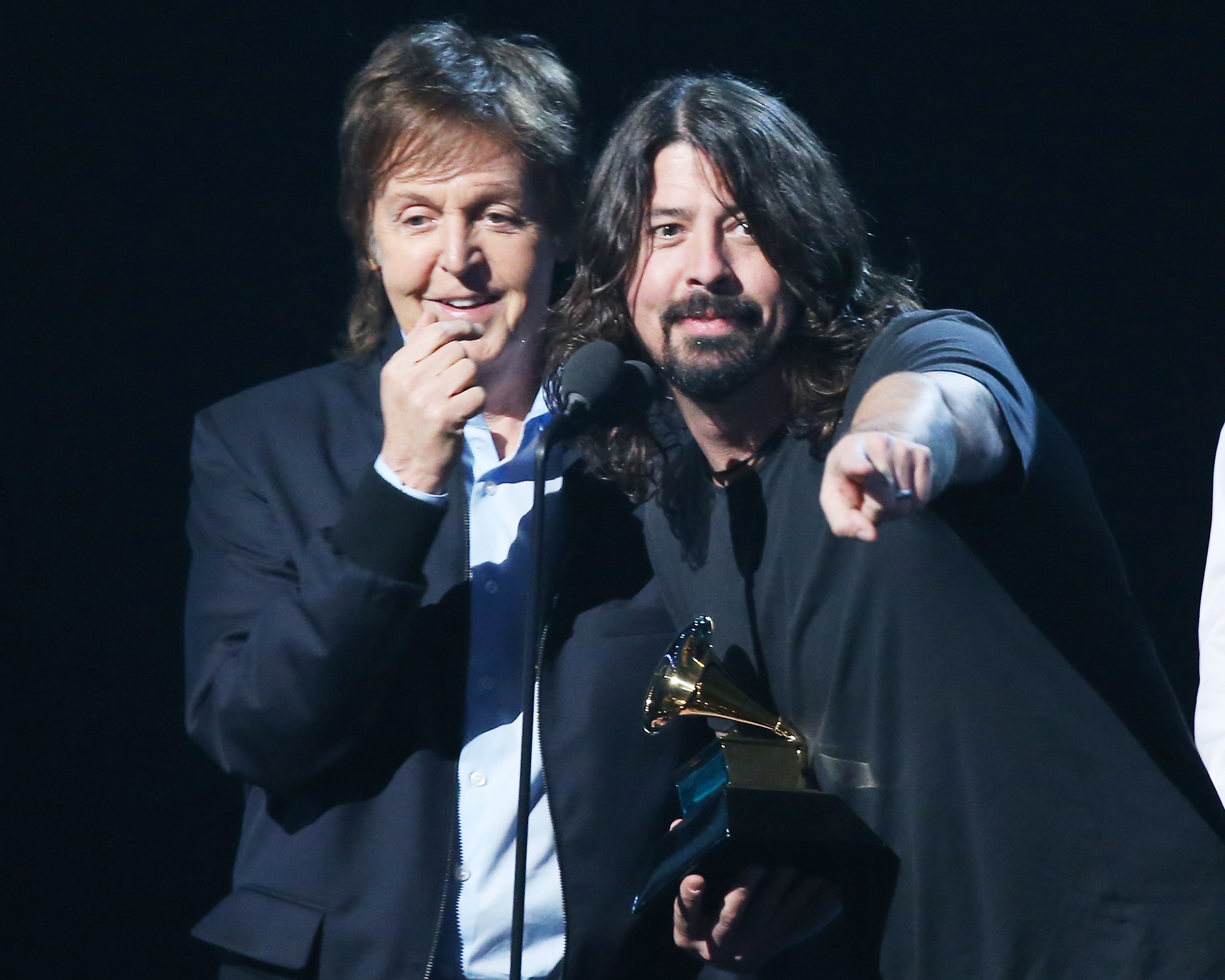 Paul McCartney and Dave Grohl at a microphone