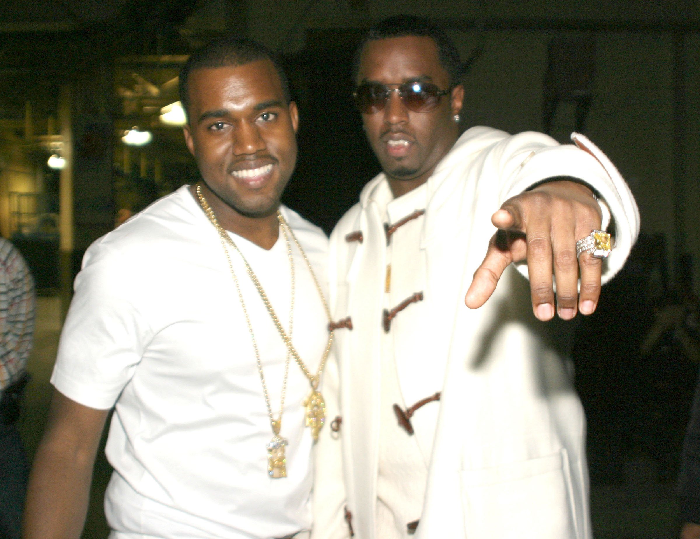 Kanye West and Diddy posing for a photo together