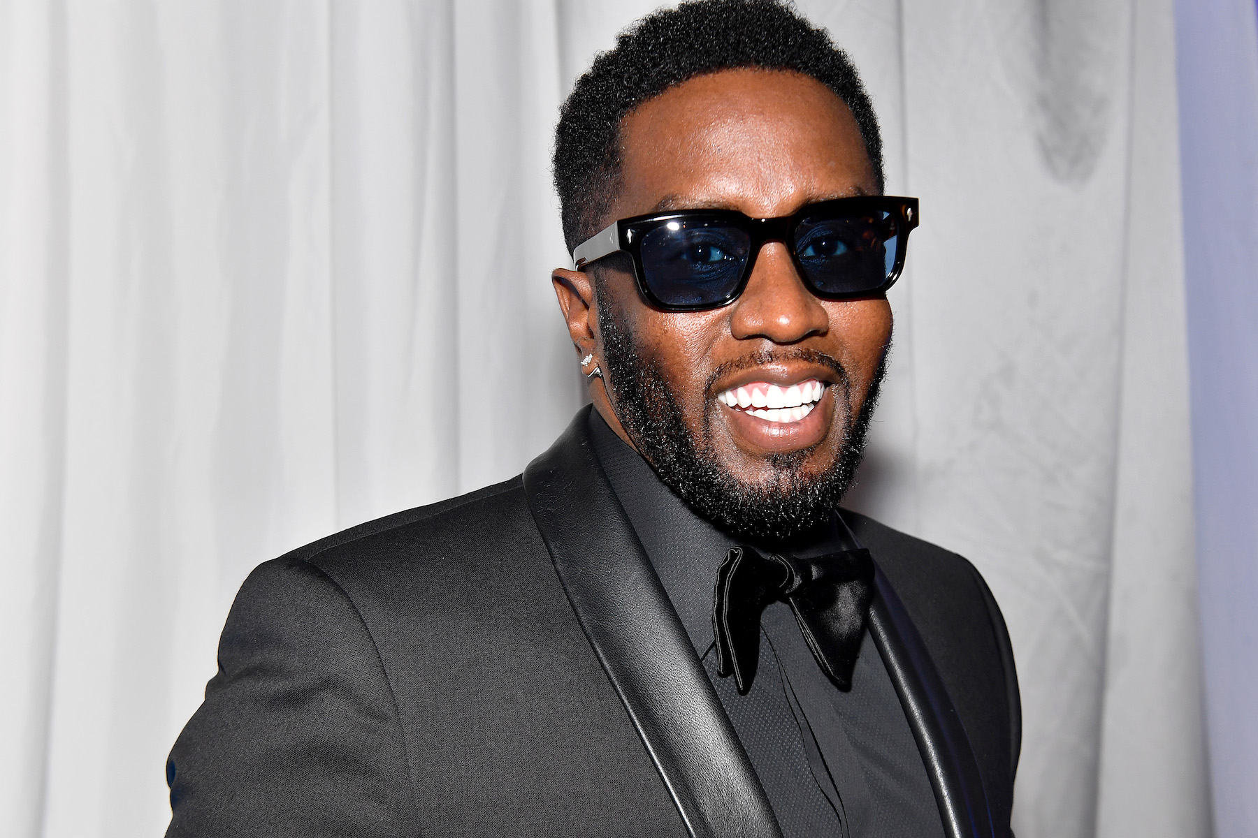Diddy, who recently called out Apple Music and Spotify, wearing a black suit