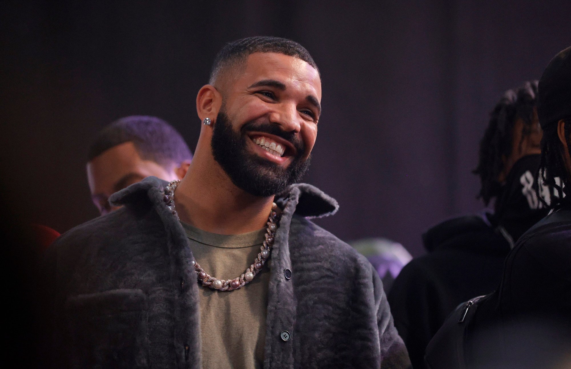 Drake, who was rumored to use ghostwriters, smiling for a photo