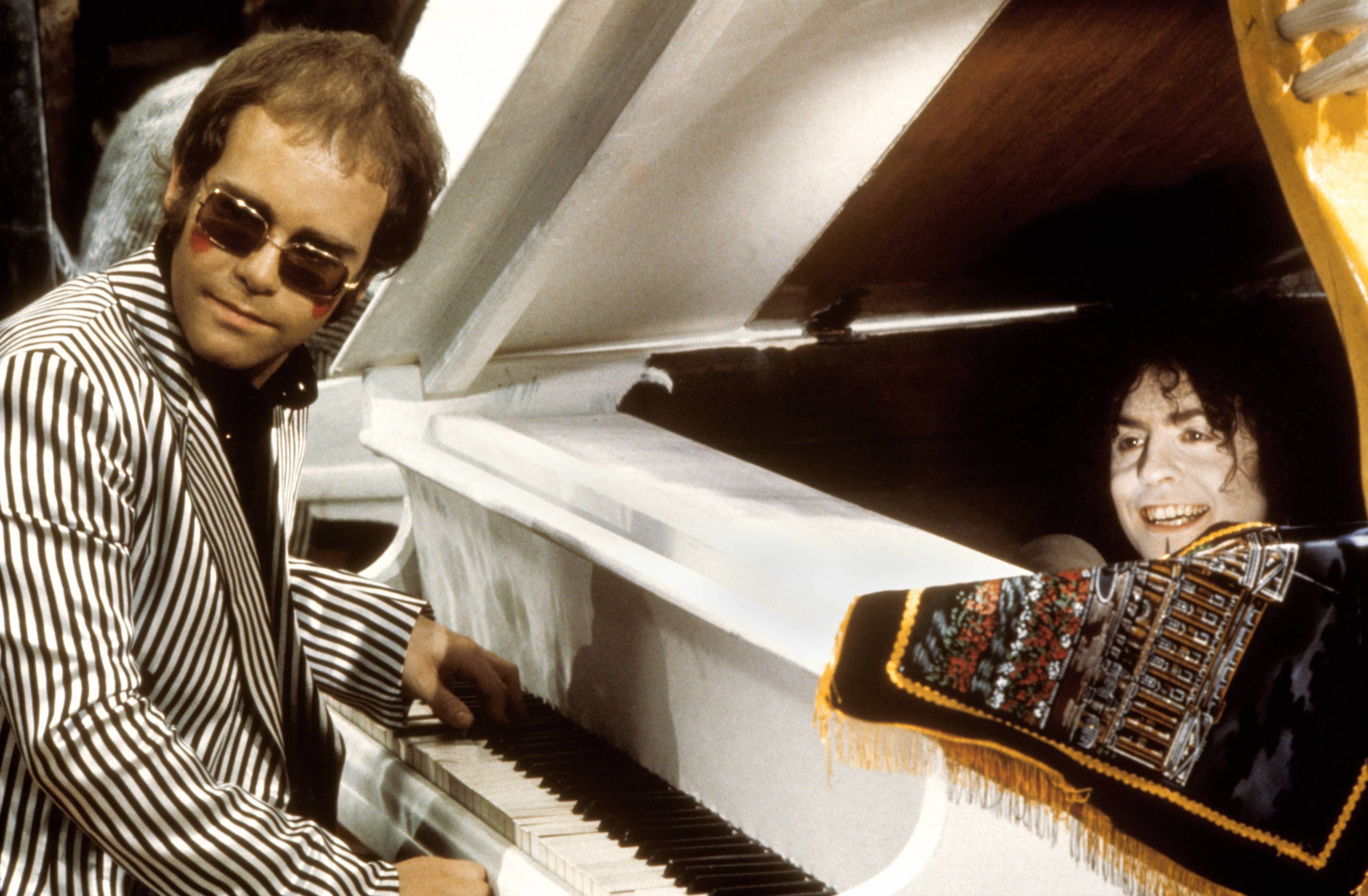 Elton John and Marc Bohan perform 'Born to Boogie' at the recording studios at the Tittenhurst home owned by John Lennon