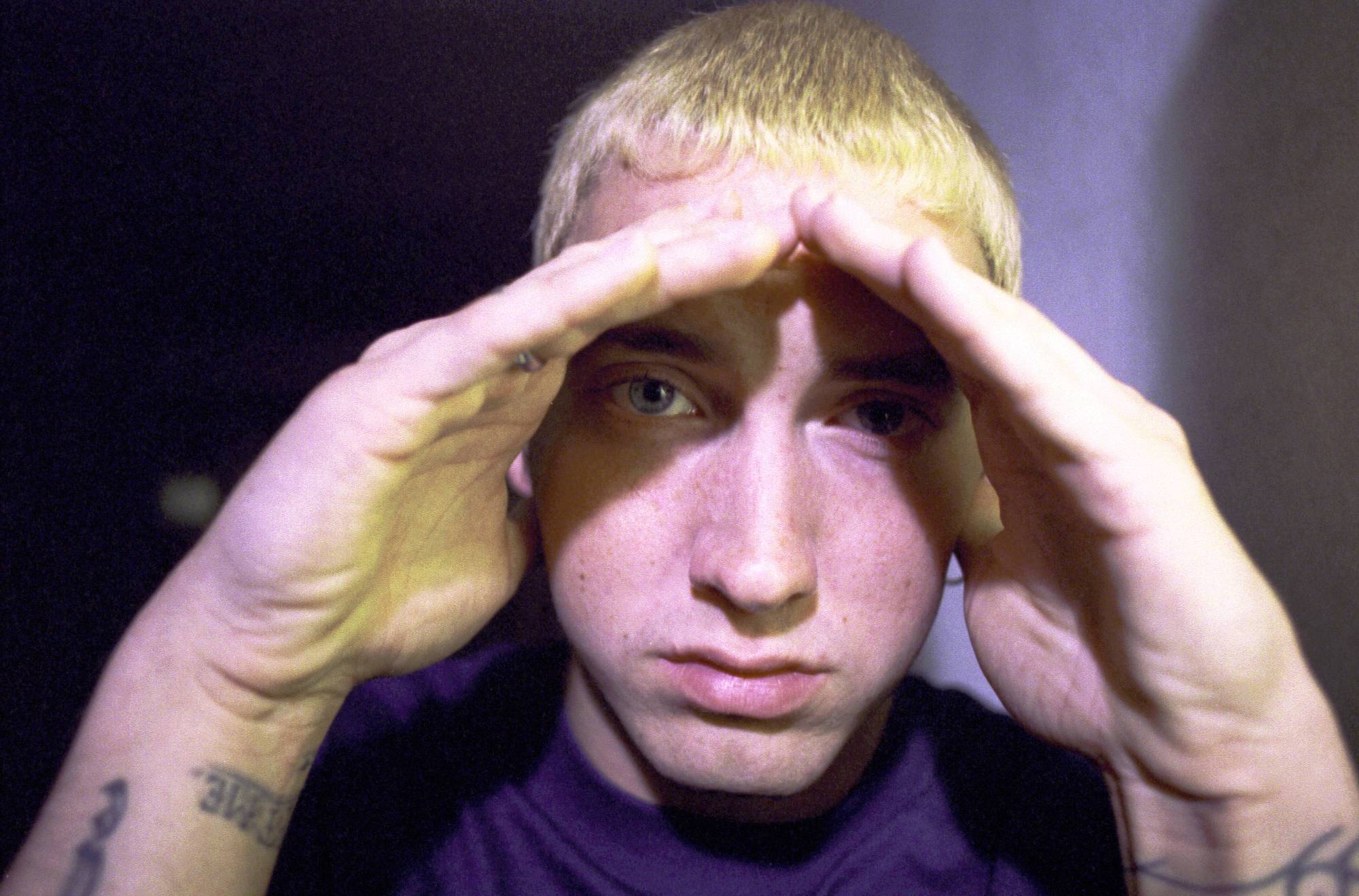 Eminem, who released his debut album 'Infinite' in 1996, posing for a photo