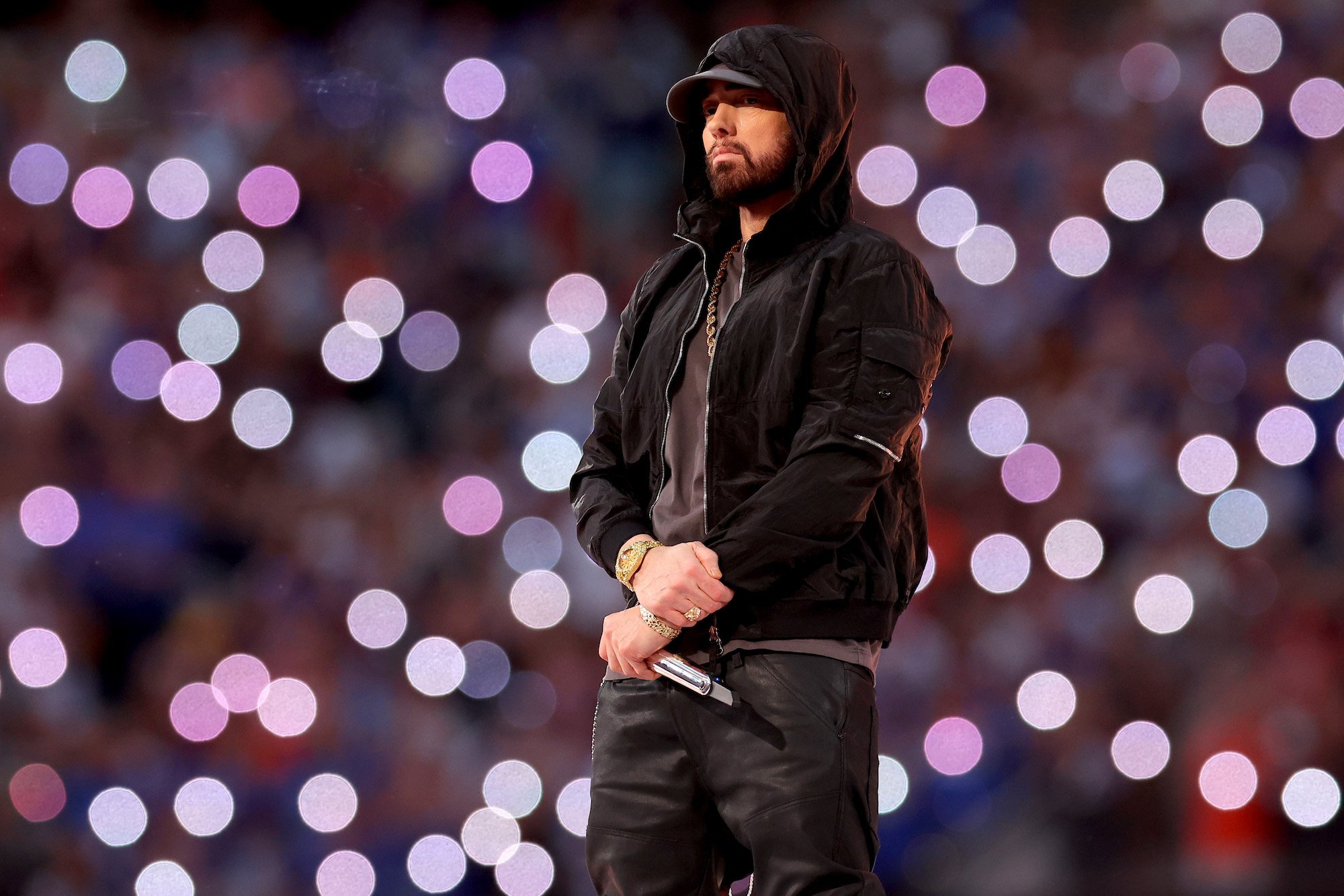Eminem, whose writing process has changed a lot over the years, performing in a black leather jacket