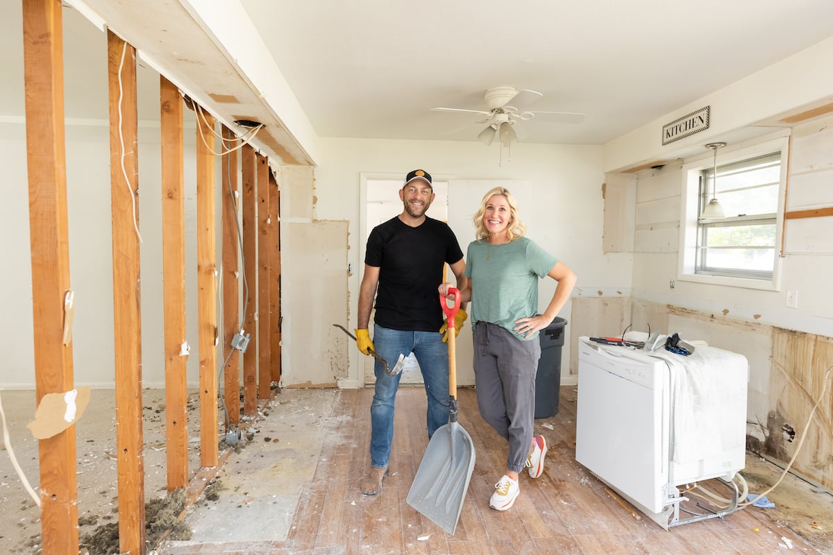 Dave and Jenny Marrs of 'Fixer to Fabulous' standing in a demolished kitchen