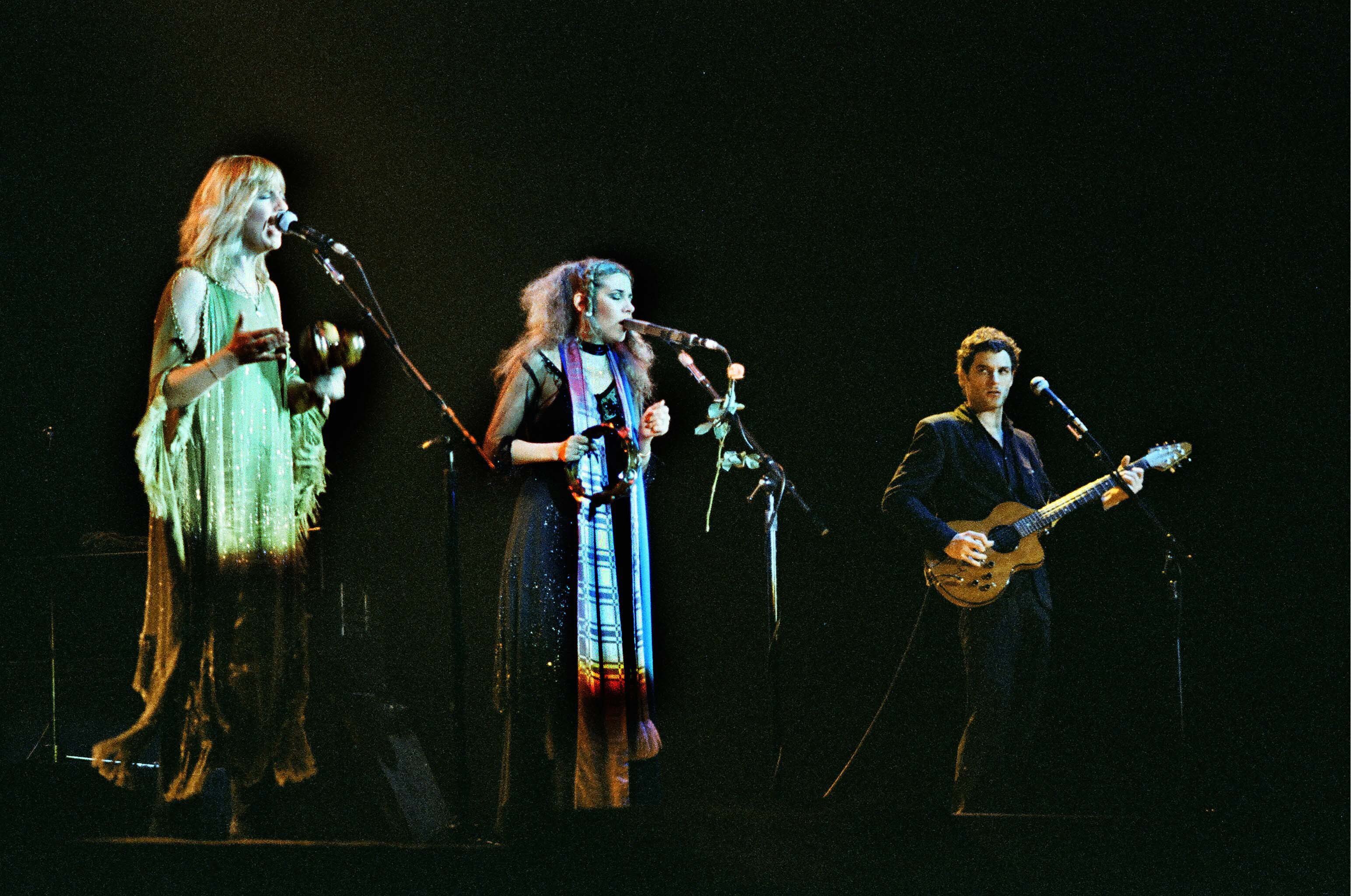 Christine McVie, Stevie Nicks, and Lindsey Buckingham of Fleetwood Mac performing live on stage