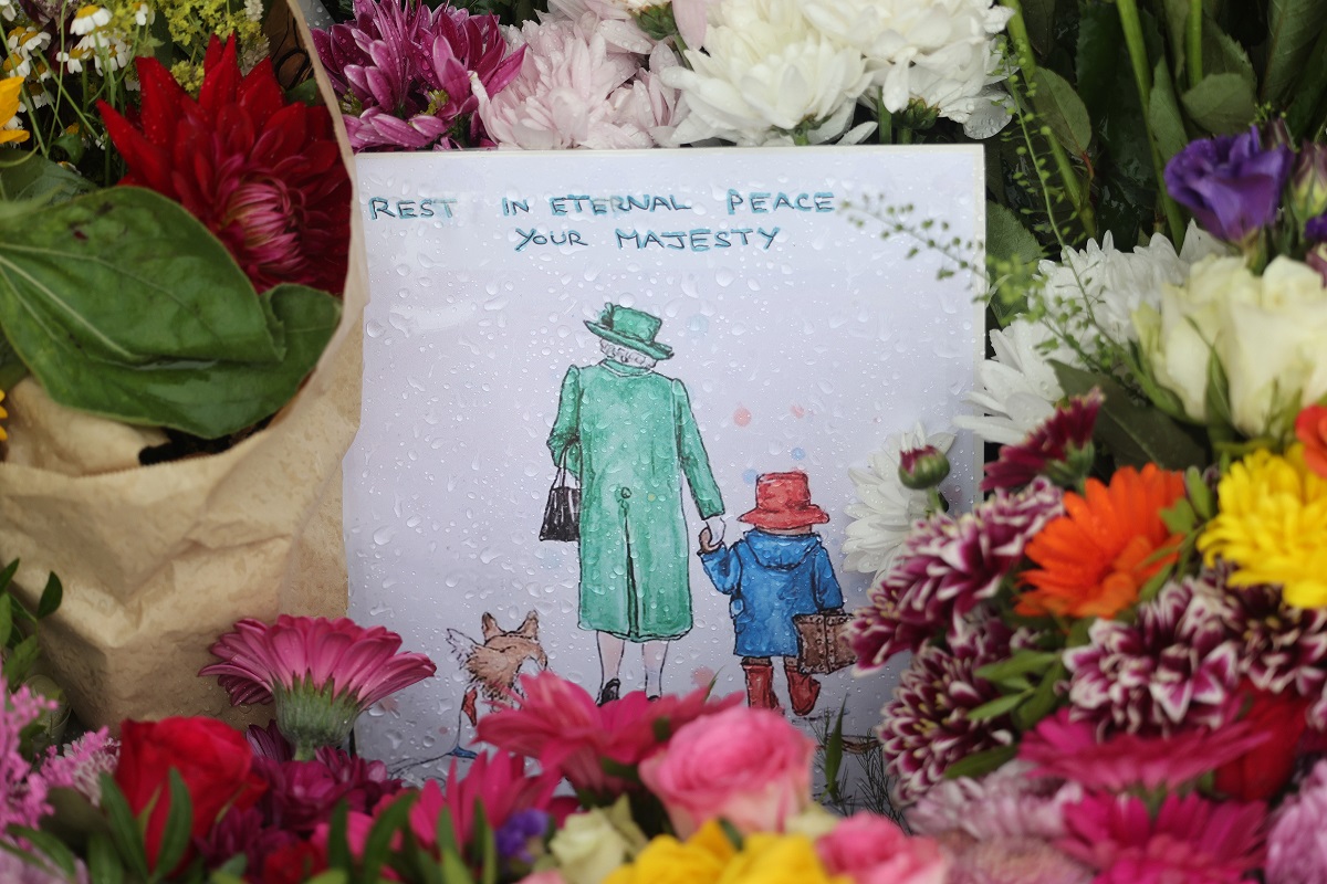 Flowers and Paddington Bear themed tributes at The Long Walk gates in front of Windsor Castle