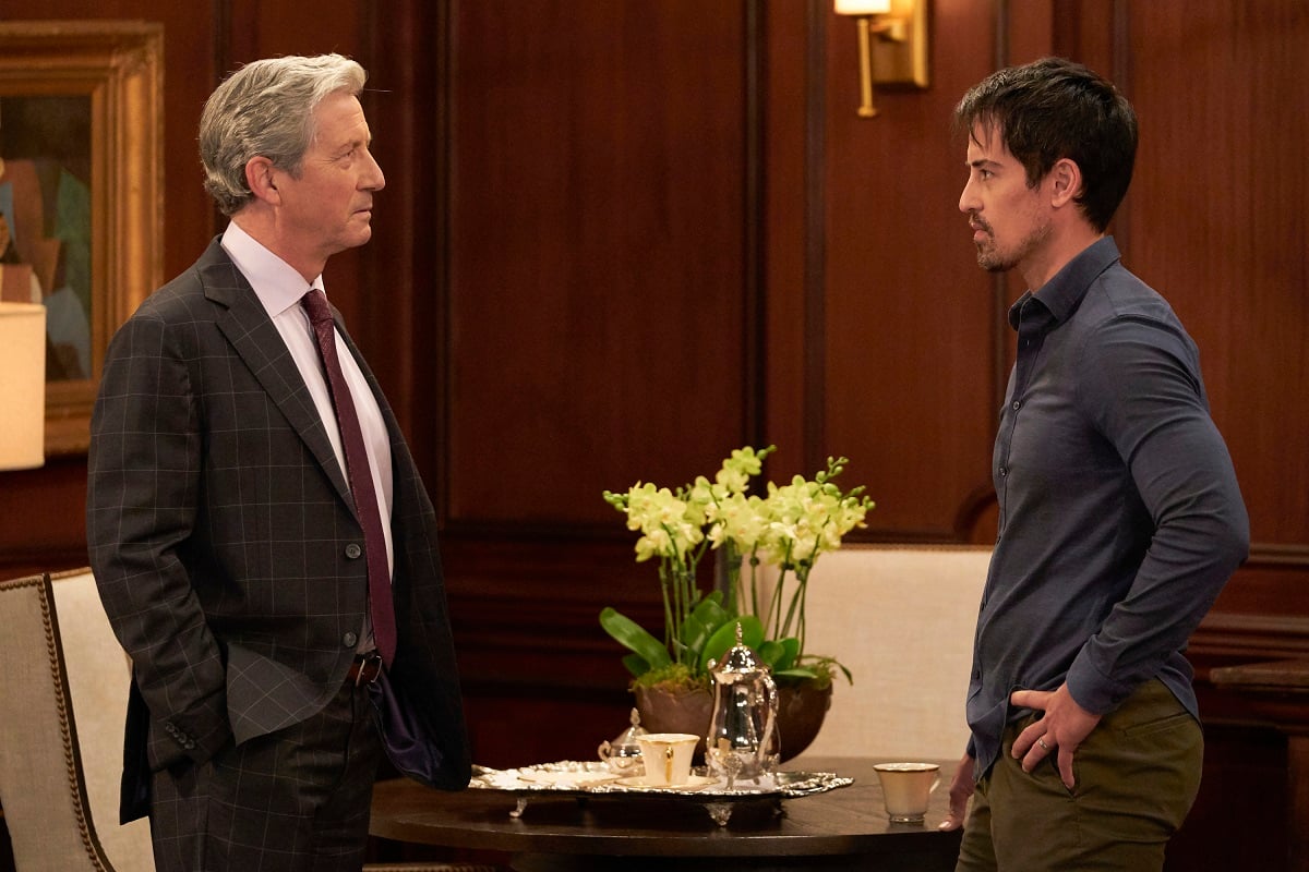'General Hospital' stars Charles Shaughnessy in a suit and Marcus Coloma in a blue shirt perform a scene from the ABC soap opera.