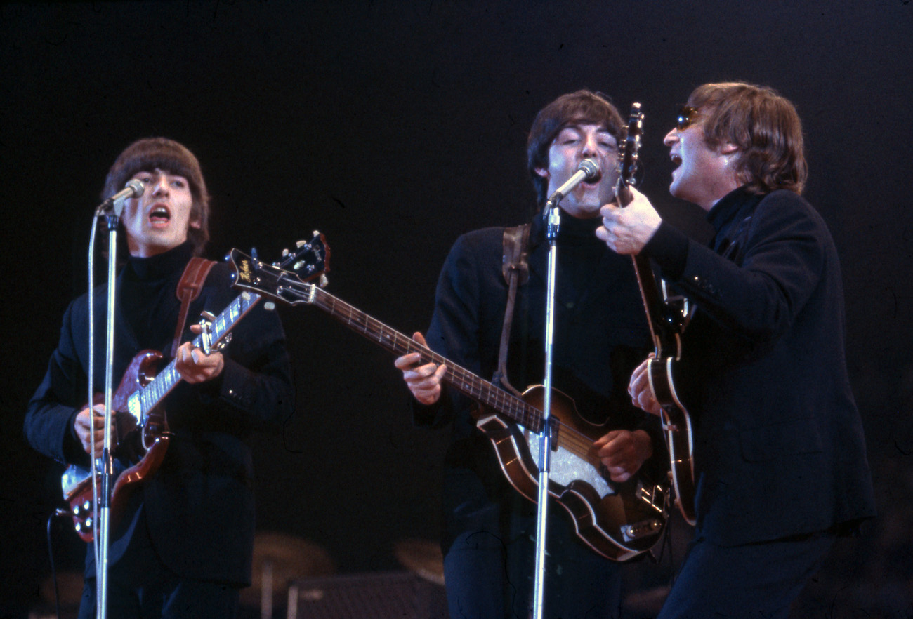 George Harrison and The Beatles performing in London in 1966.