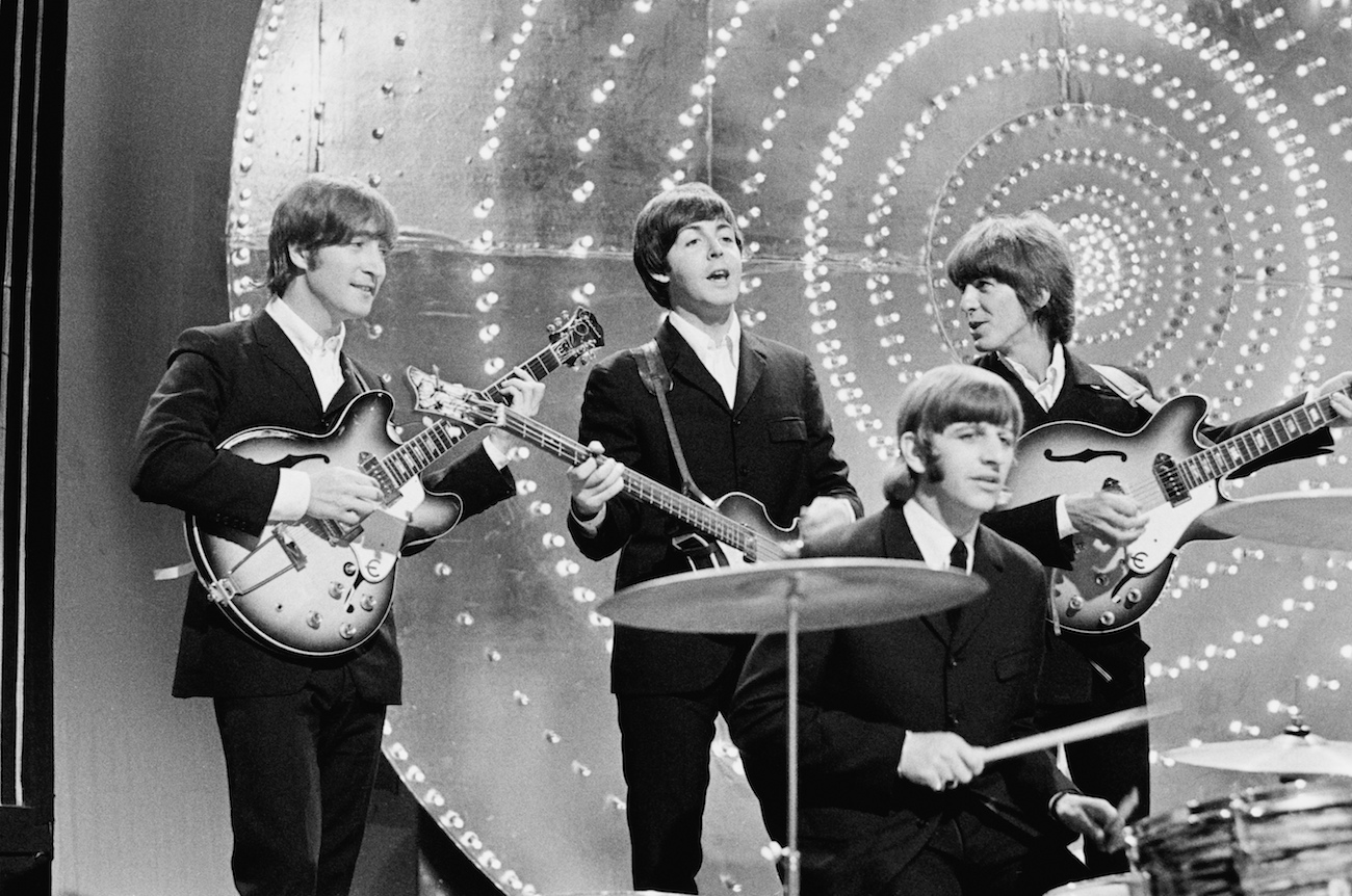 George Harrison and The Beatles performing on a BBC show.