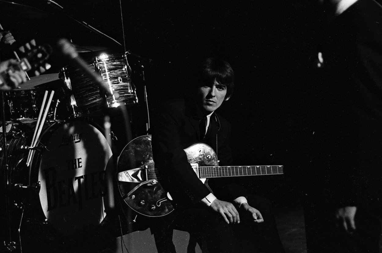 George Harrison, who faced problems getting songs on Beatles albums even after a prolific year, shown during a 1964 performance.