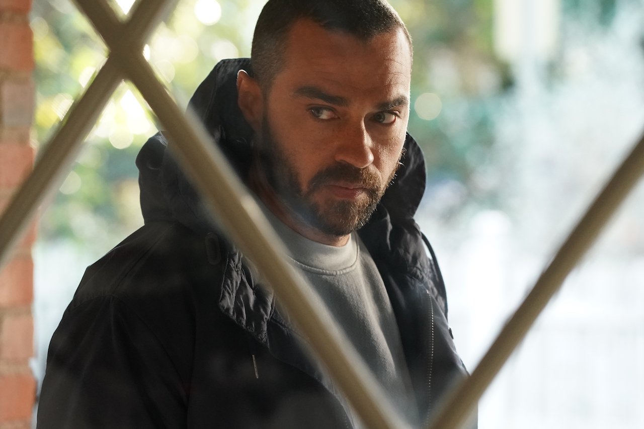 A closeup of a bearded Jesse Williams as Jackson Avery on 'Grey's Anatomy' standing outside.