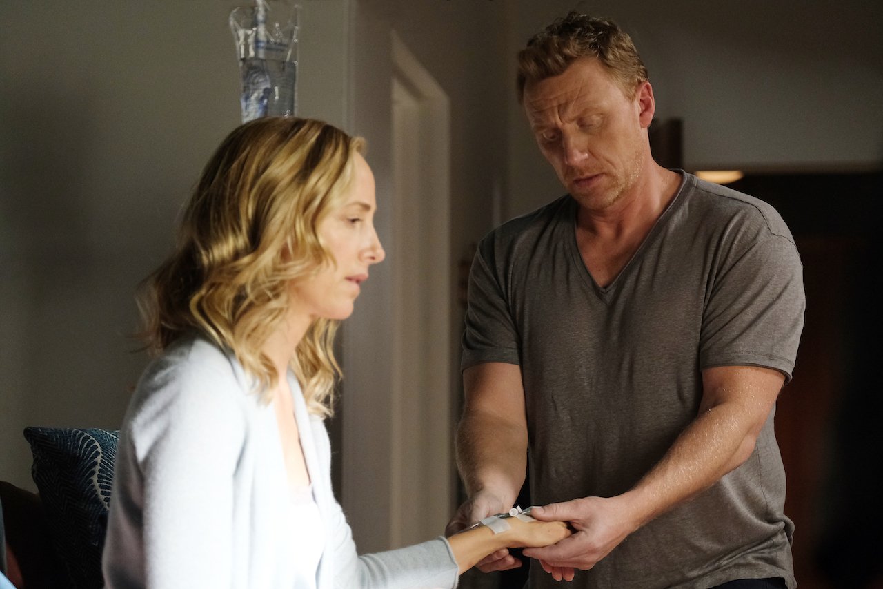 Kevin McKidd as Owent Hunt checks Kim Raver as Teddy Altman's hand on 'Grey's Anatomy'.