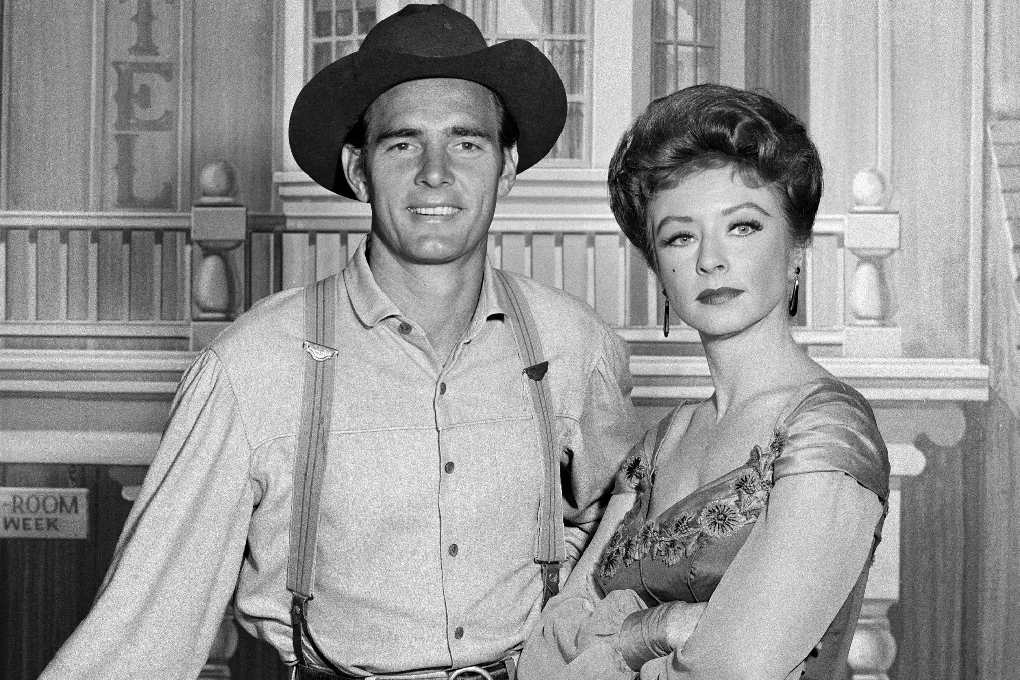 'Gunsmoke' Dennis Weaver as Chester Goode and Amanda Blake as Kitty Russell. Weaver is smiling in Western costume. Blake has her arms crossed.