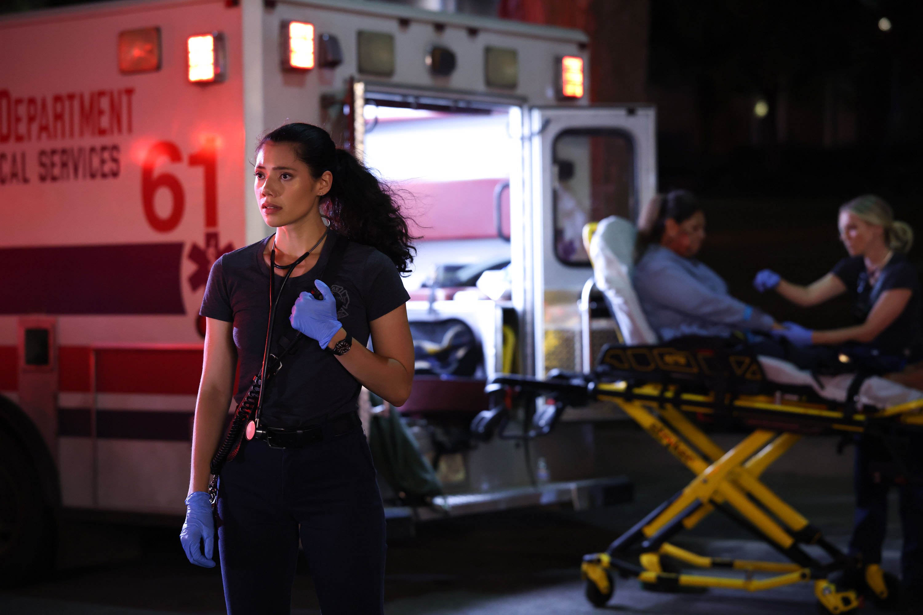 Hanako Greensmith as Violet standing in front of an ambulance in 'Chicago Fire' Season 11 Episode 3