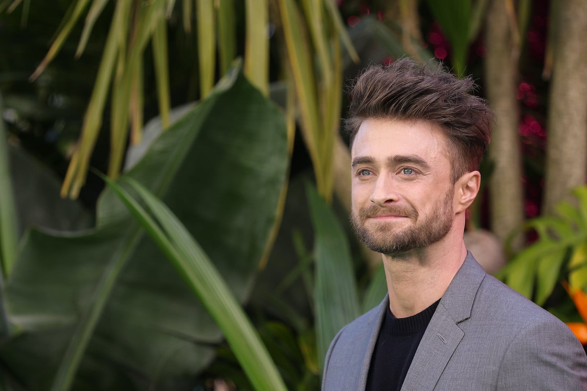 Harry Potter alum Daniel Radcliffe in a grey suit