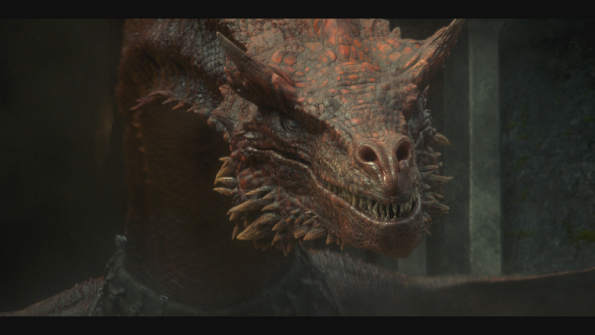 Daemon's dragon Caraxes in House of the Dragon has red scales and sharp teeth. 