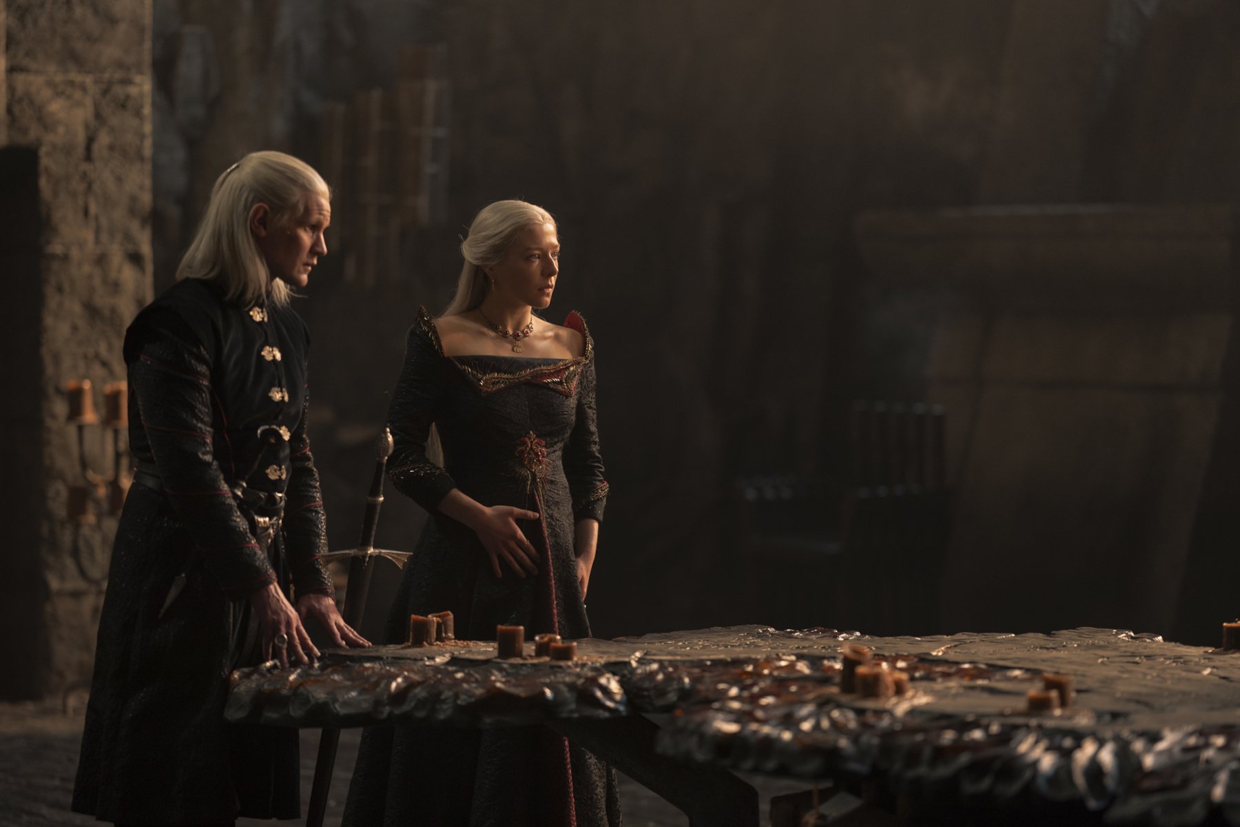 Matt Smith and Emma D'Arcy as Daemon and Rhaenyra Targaryen in 'House of the Dragon' Season 1, which kicks off the Dance of the Dragons. They're standing at the head of a table together.