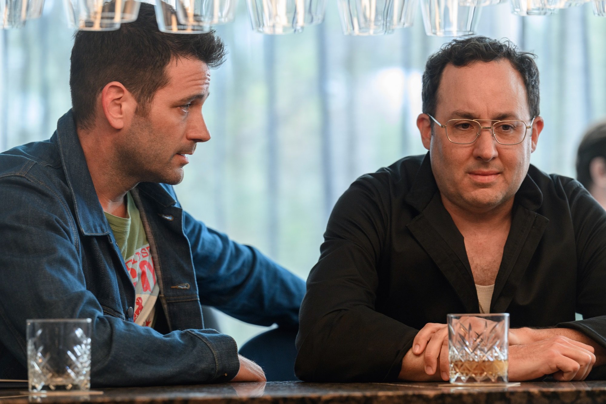 'Irreverent' on Peacock: Colin Donnell as Mack/Paulo, P.J. Byrne as Mckenzie Boyd sitting together at a bar