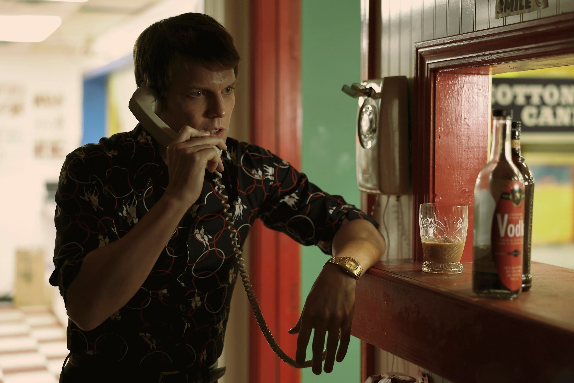 Jake Lacy as Robert Berchtold in 'A Friend of the Family' on a pay phone