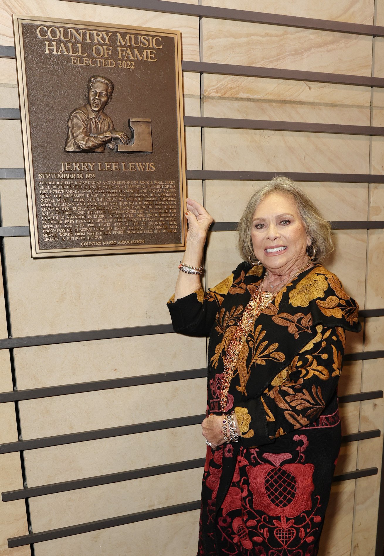 Jerry Lee Lewis' wife, Judith Brown, with a plaque for her husband at the Country Music Hall of Fame and Museum