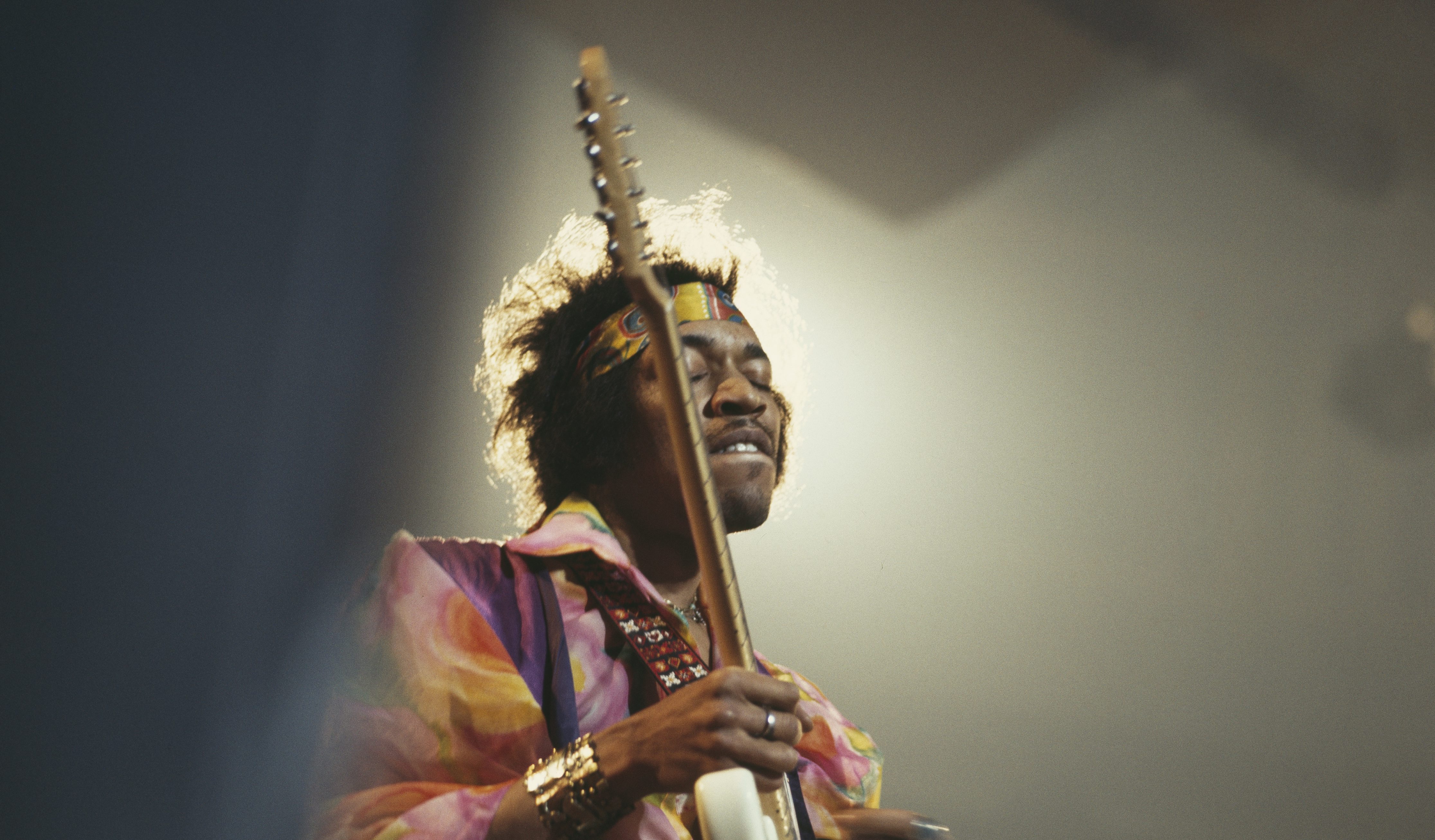 Jimi Hendrix, who performed at the Monterey Pop Festival in 1967, playing guitar