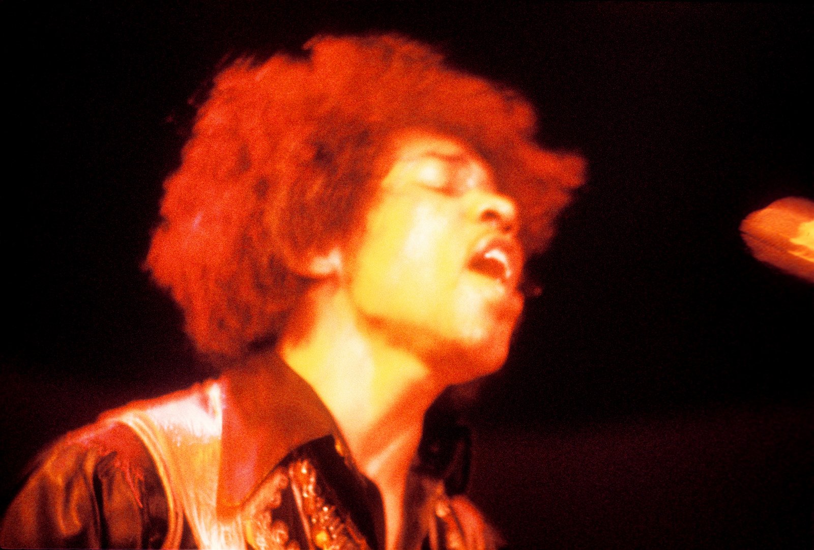 Jimi Hendrix, who lived in an apartment in London, performing on stage