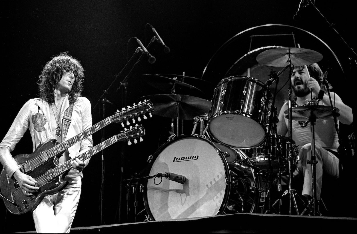 Jimmy Page (left) and John Bonham during a 1977 Led Zeppelin concert, several years after Page started lying about Bonham's drum sound on 'When the Levee Breaks.'