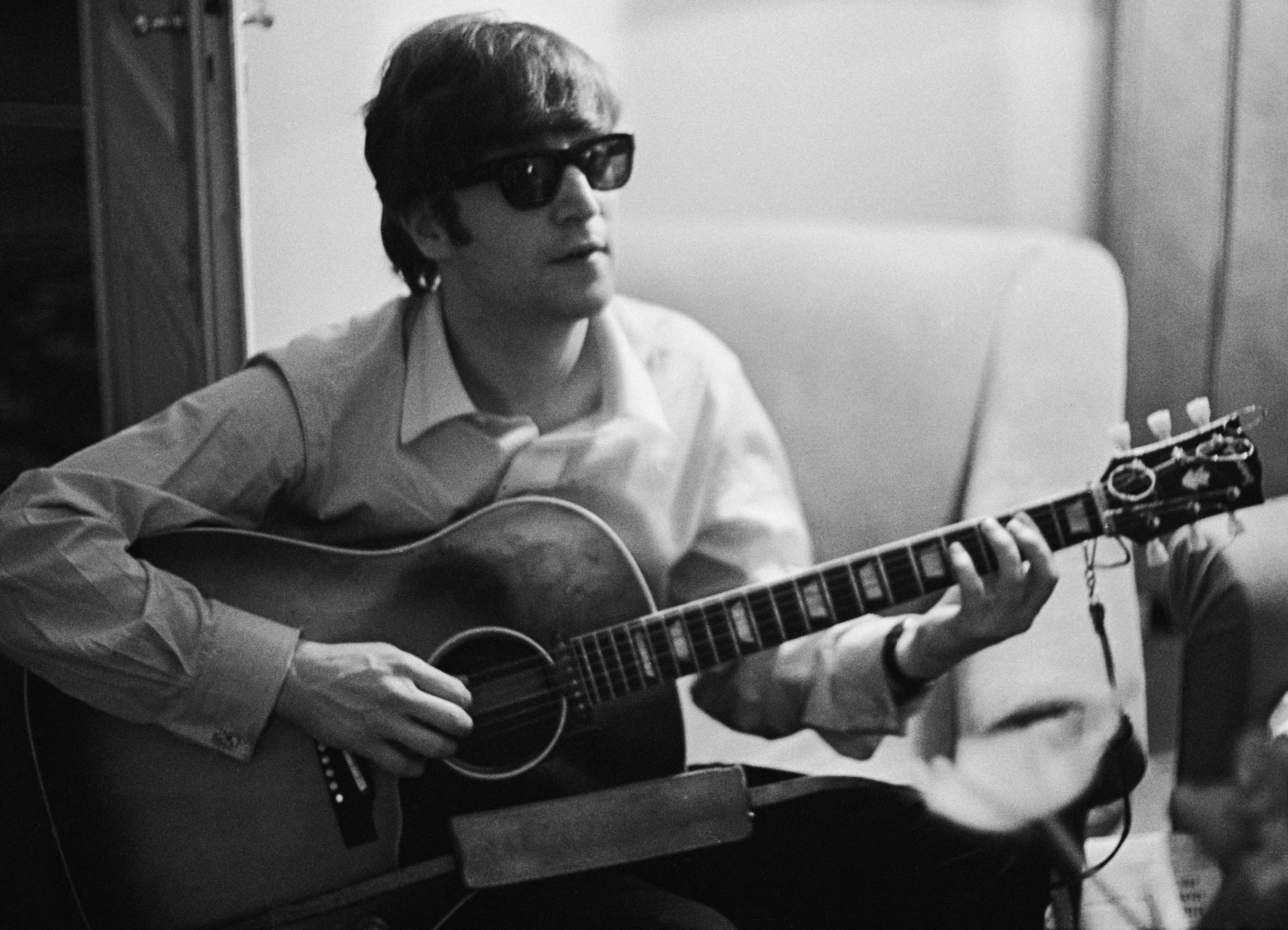 The Beatles' John Lennon with a guitar