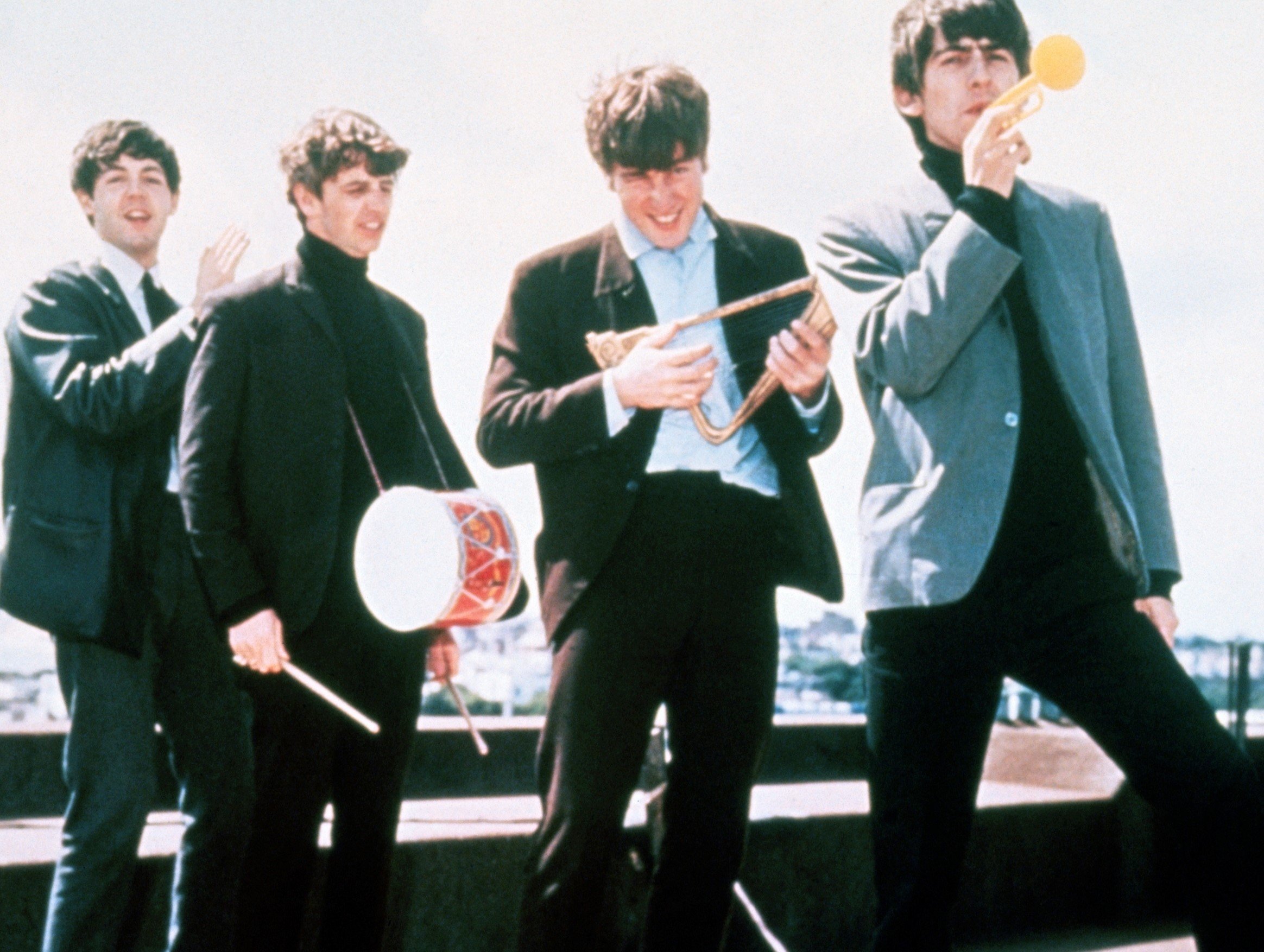 The Beatles’ Paul McCartney, Ringo Starr, John Lennon, and George Harrison on a roof