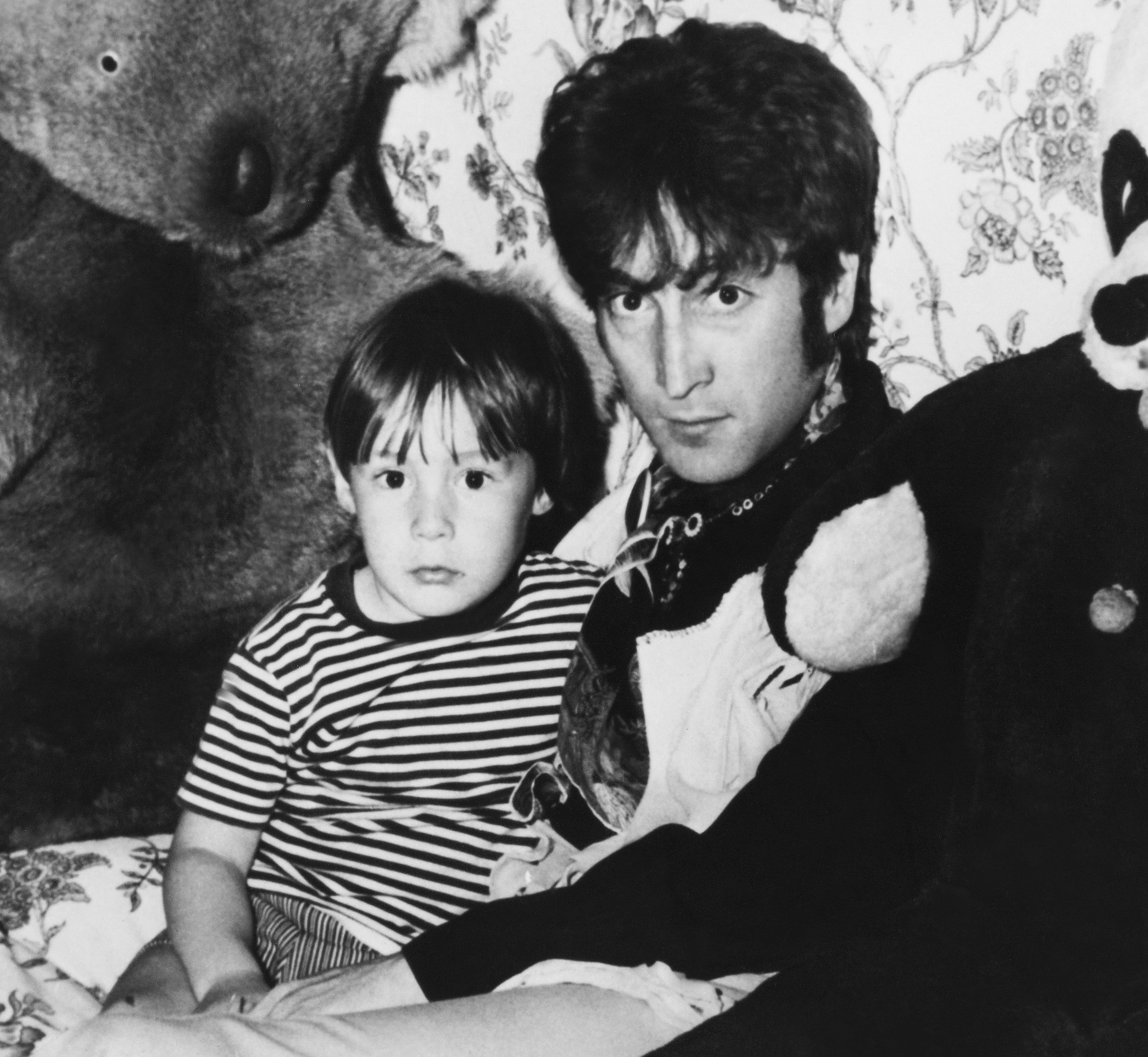 John Lennon and his son, Julian Lennon, near stuffed animals