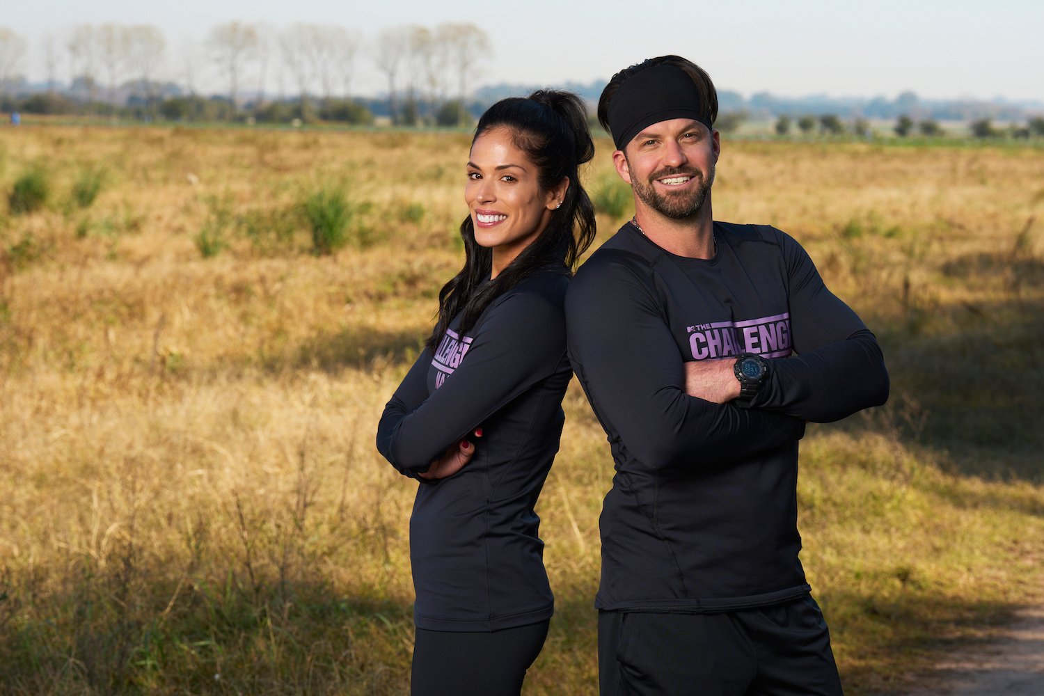 Johnny 'Bananas' Devenanzio and Nany González standing back to back in 'The Challenge' Season 38