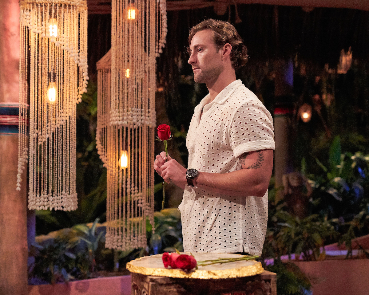 Johnny DePhillipo holding a rose to give to Victoria Fuller on 'Bachelor in Paradise' Season 8