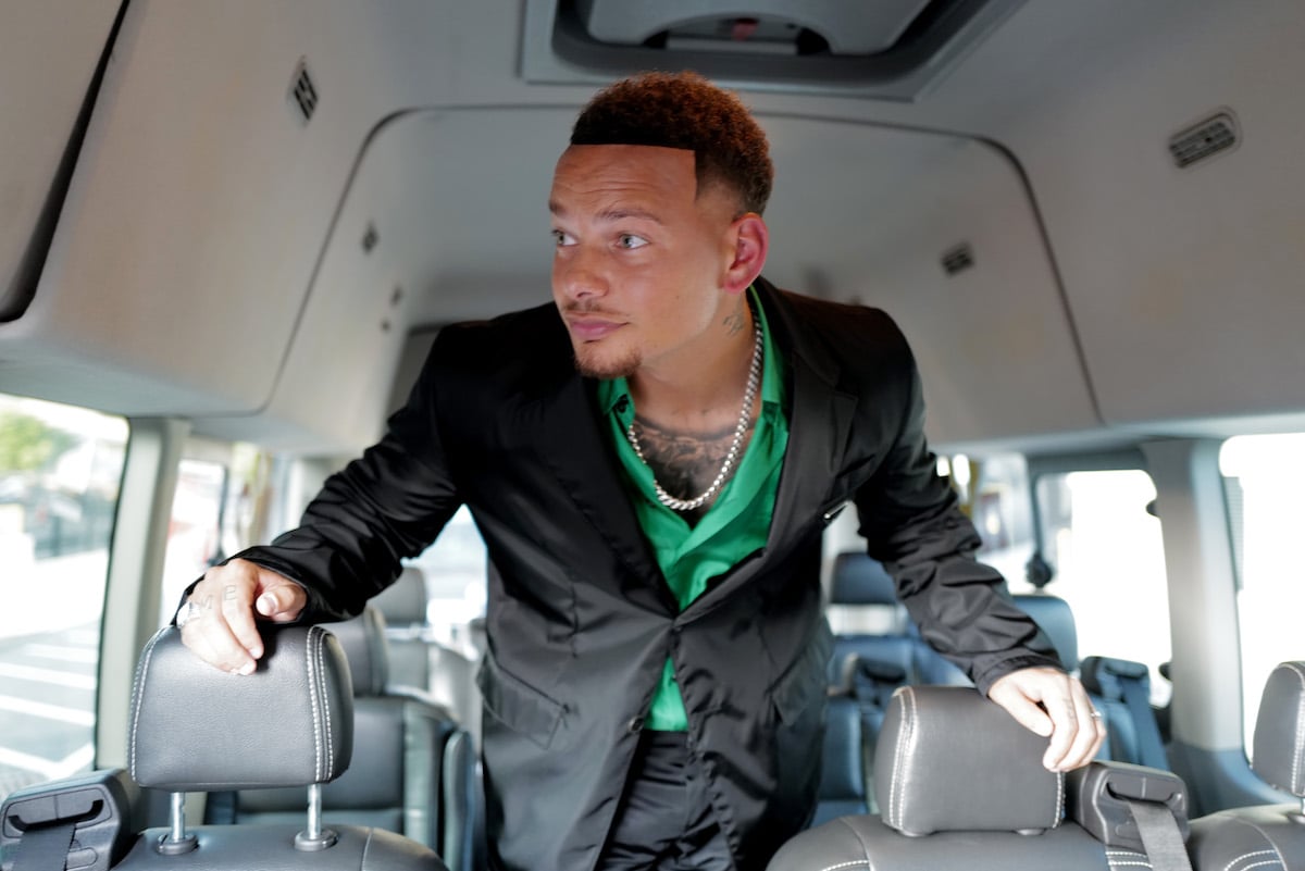 Kane Brown, looking outside of a bus window