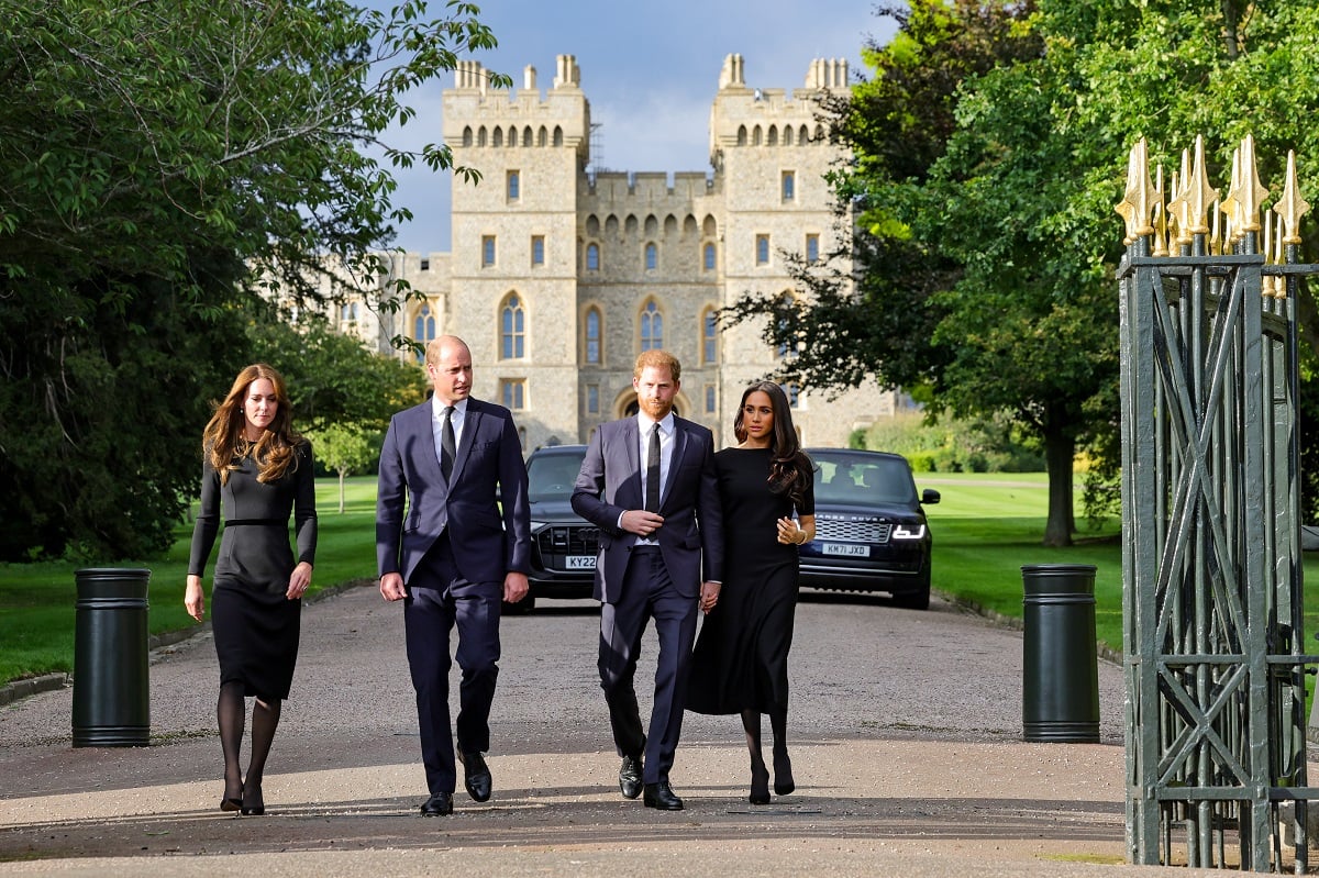 Kate Middleton, Prince William, Prince Harry, and Meghan Markle on the Long Walk at Windsor Castle to view Queen Elizabeth II tributes