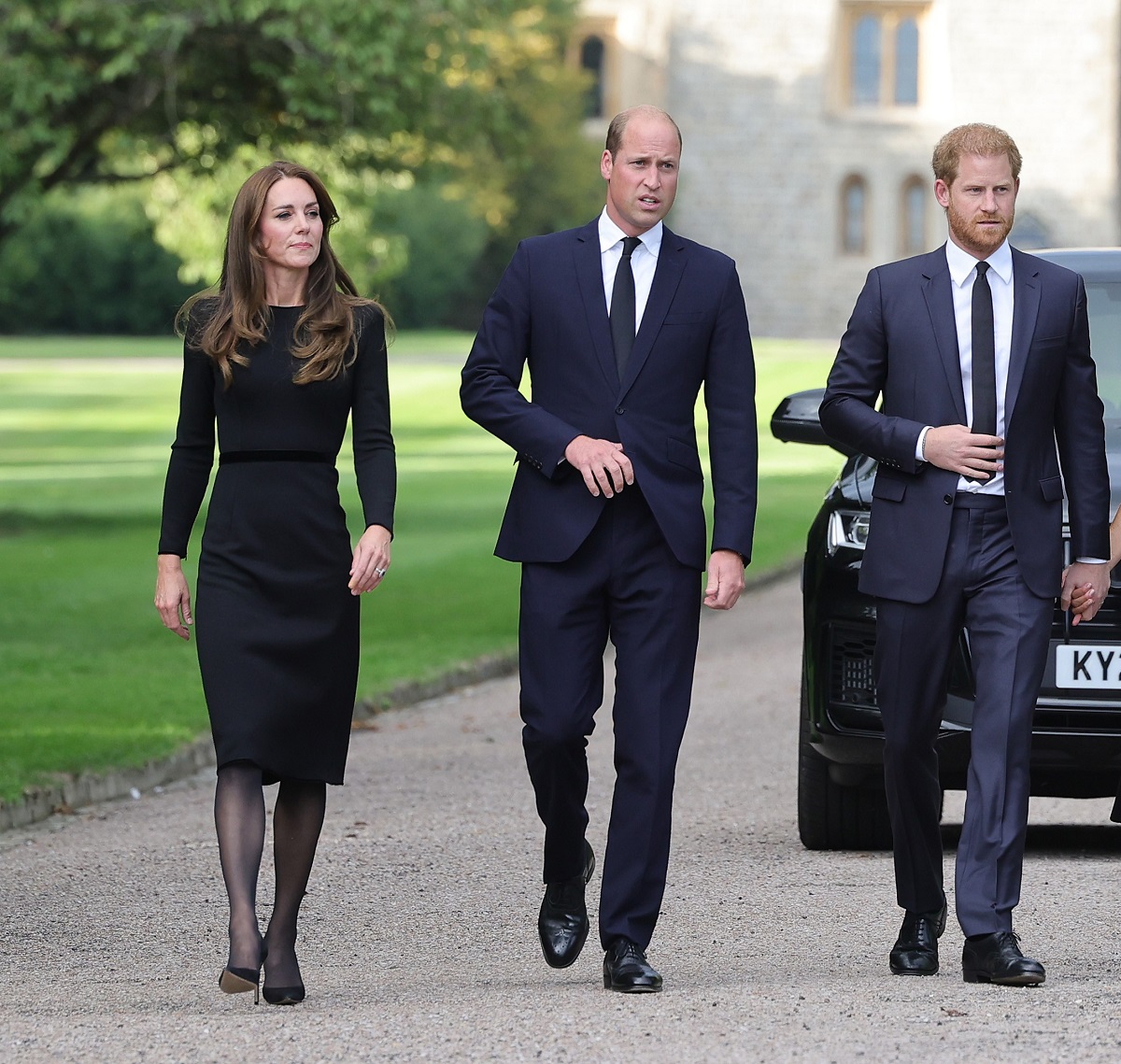 Kate Middleton, Prince William, and Prince Harry on the long Walk at Windsor Castle arrive to view flowers and tributes to Queen Elizabeth II