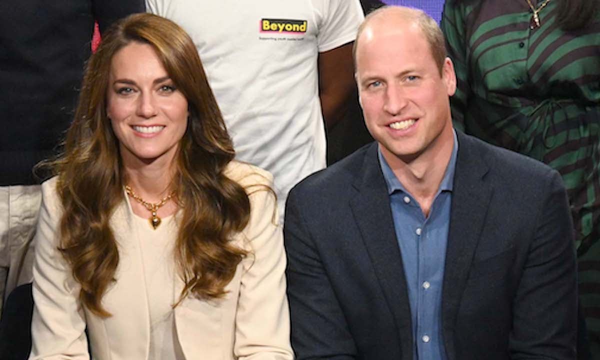 Kate Middleton and Prince William, who did 'something different' with their body language during BBC Radio 1 'Newsbeat' guest radio appearance in Oct. 2022 according to body language expert Judi James, sit next to each other and smile