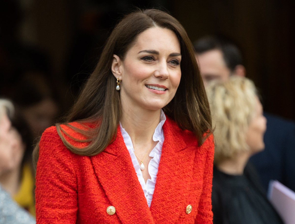 Kate Middleton, wearing the same red blazer she wears in an Oct. 2022 video to England's rugby team where she offers a 'glimpse' of what she'll be like as queen, looks on during an appearance in Denmark
