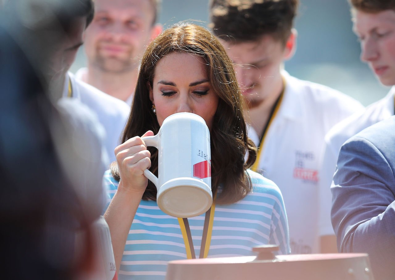 Kate Middleton, pictured with a beer in 2017, reportedly started a drinking society for women to turn the tables on tradition.