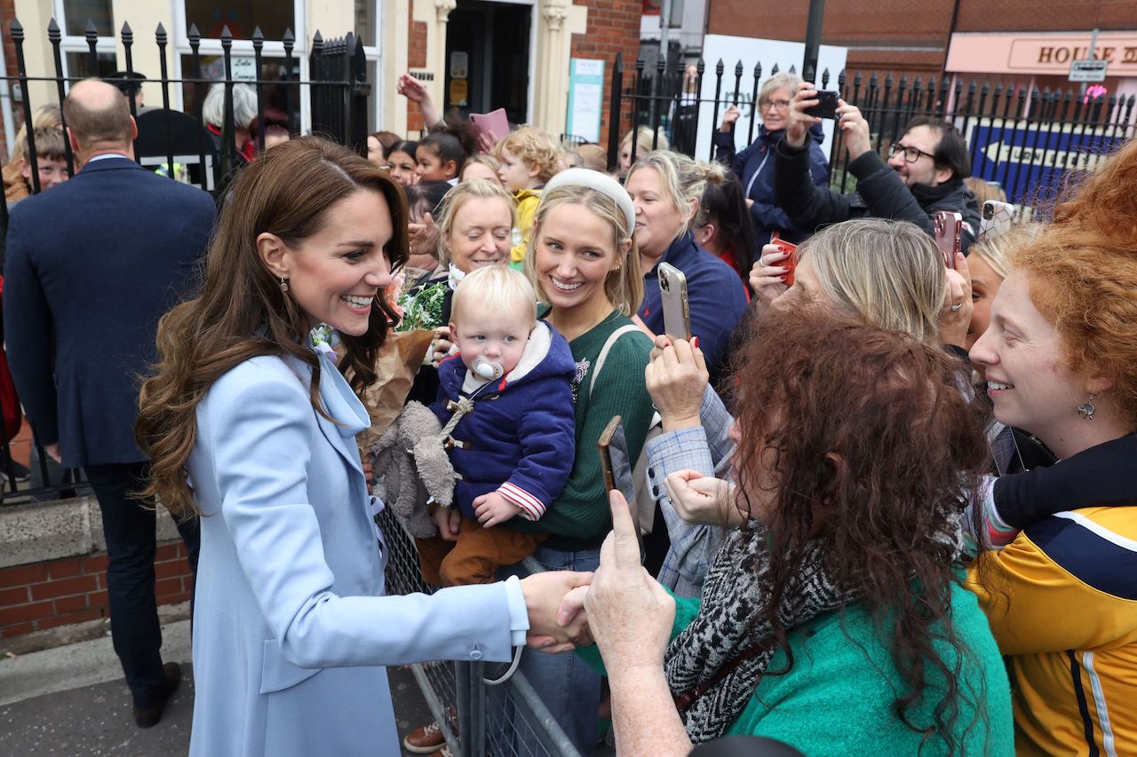 Kate Middleton meeting well-wishers, including a person who heckled her.