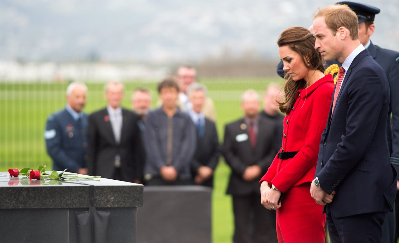 Kate Middleton and Prince William place roses at a Memorial Wall at Wigram Air Force Museum on April 14, 2014, in Christchurch, New Zealand.