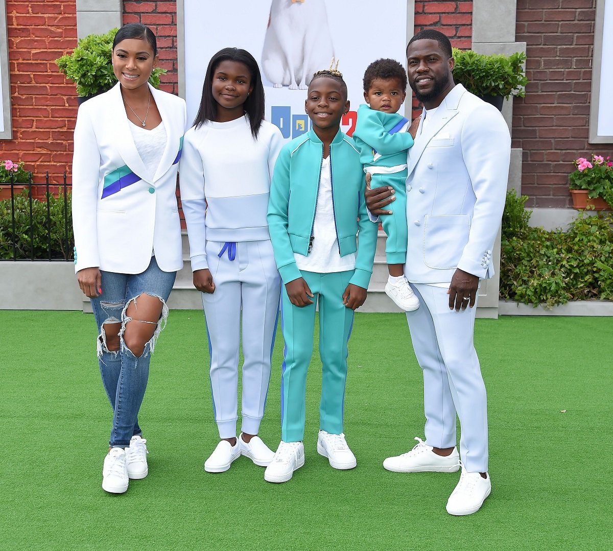 Kevin Hart with his wife Eniko Parish, and children Hendrix, Heaven, and Kenzo walk the carpet at 'The Secret Life of Pets 2' premiere