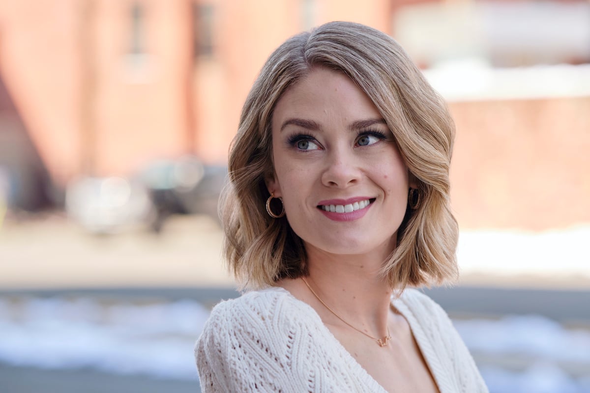 Kim Matula in a white sweater in 'Ghosts of Christmas Always' on Hallmark Channel