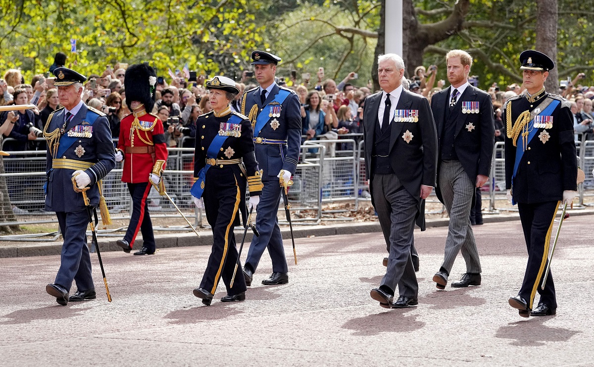 King Charles III, Princess Anne, Prince Andrew, Prince Edward, Prince William and Prince Harry walk behind the coffin during a ceremonial procession for the coffin of Queen Elizabeth II 
