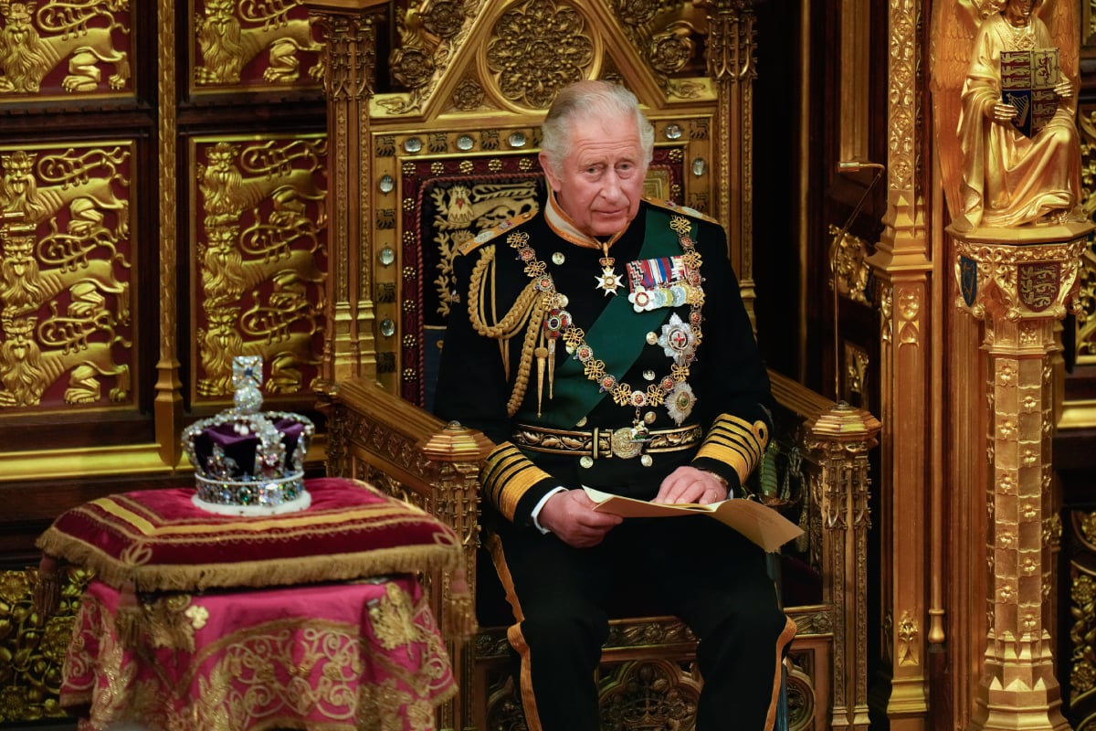 Prince Charles, Prince of Wales — now King Charles III — reads the Queen's speech next to her Imperial State Crown in the House of Lords Chamber, during the State Opening of Parliament in the House of Lords at the Palace of Westminster on May 10, 2022 in London, England