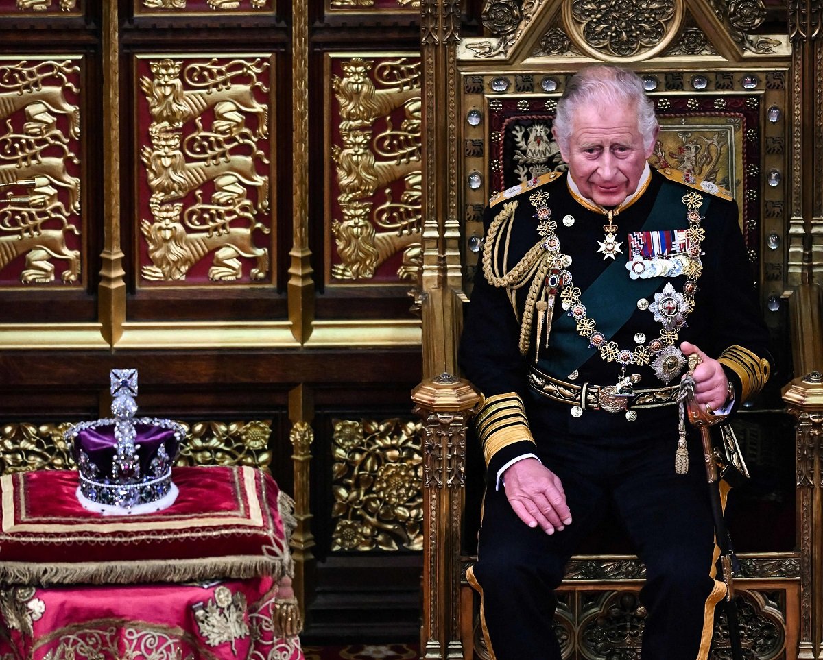 King Charles III's, who will have his coronation next year, sitting by the Imperial State Crown during the State Opening of Parliament 