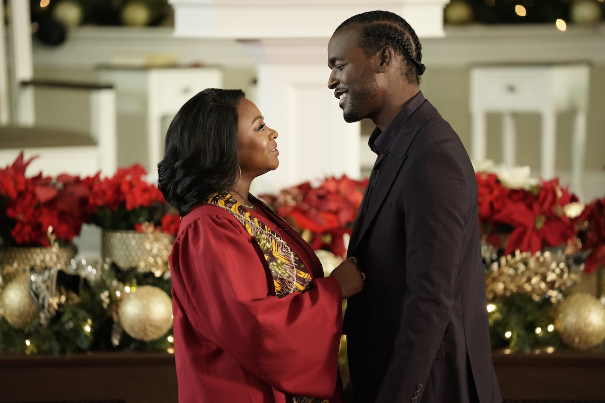 Woman holding the lapels of a man's jacket in 'Kirk Franklin's The Night Before Christmas'