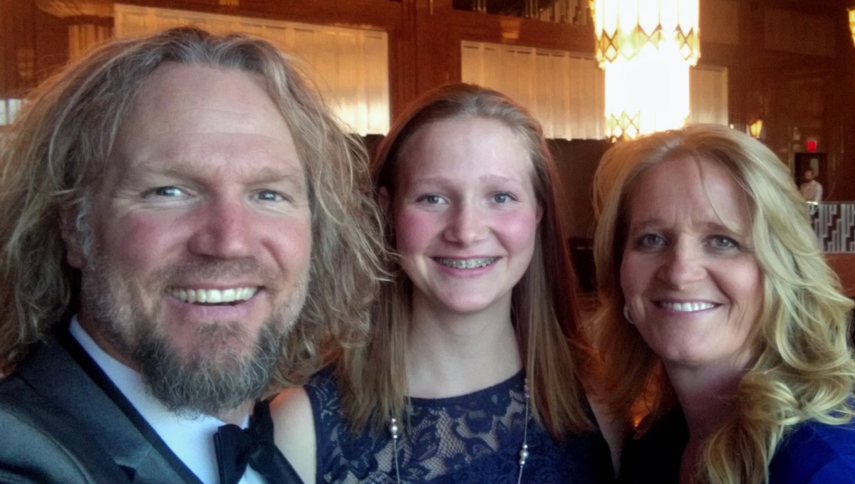 Kody Brown, Ysabel Brown, and Christine Brown pose together smiling on 'Sister Wives' on TLC.