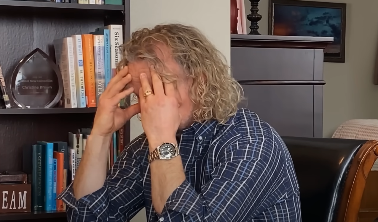 Kody Brown, Christine Brown's ex-husband,  sits at a table in Christine Brown's house as they discuss their divorce in season 17 of 'Sister Wives'