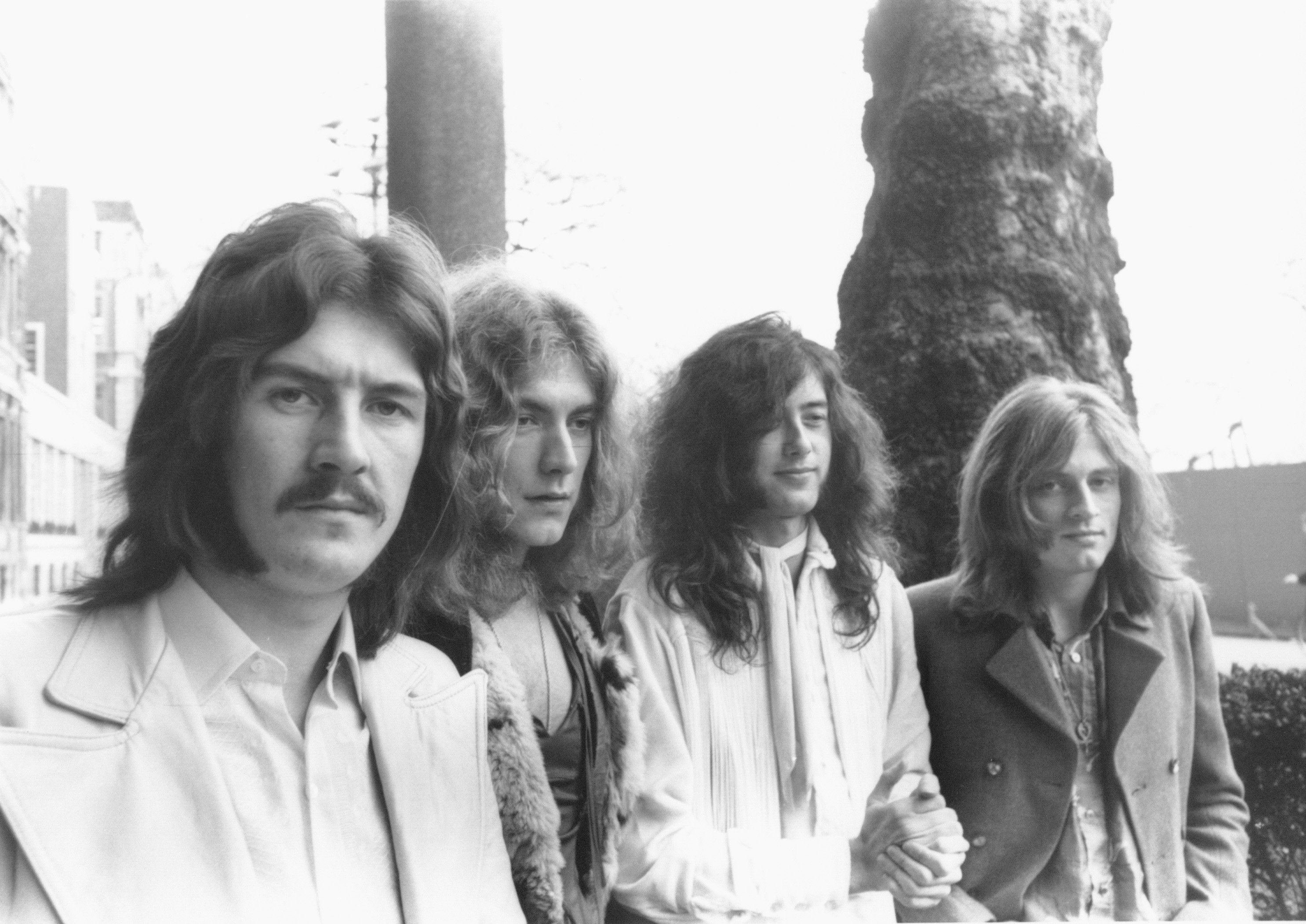 A black-and-white photo of John Bonham, Robert Plant, Jimmy Page and John Paul Jones of Led Zeppelin